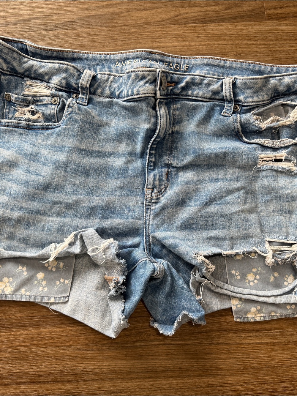 American Eagle Outfitters Light Wash Distressed Denim Shorts with Floral Trim